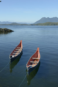 Two native canoes anchored in Tofino Harbour