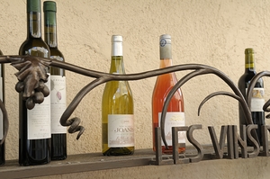 Les Vins Du Luberon store sign with bottled wine