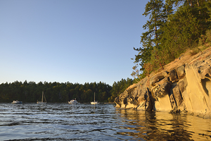 Sculpted sandstone cliff in front of the Tent Island anchorage by Kevin Oke