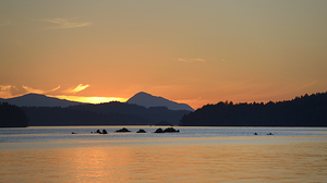 Kayakers near islets at the entrance to Princess Bay by Kevin Oke