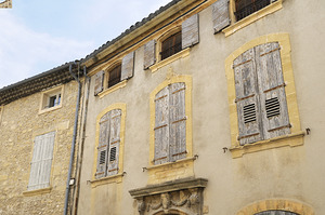 Shuttered windows on an old apartment  building Lourmarin Vaucluse Provence Alpes Côte dAzur France