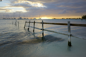 Old fence running into the ocean