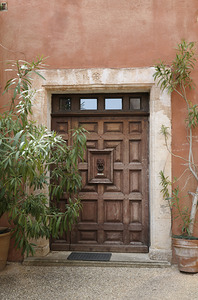 Wooden door with door knocker. Roussillon. France