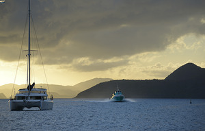 Passenger ferry and anchored catamaran at Sopers Hole