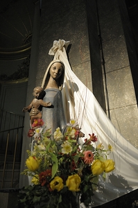 Wood carving of the virgin with bouquet of flowers Eglise Saint Pothin by Kevin Oke