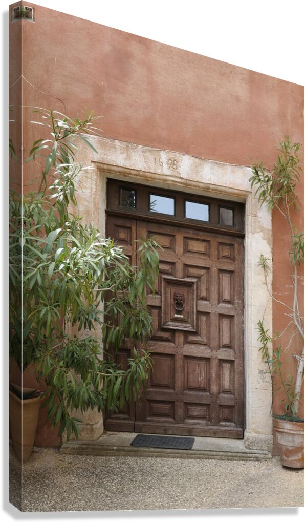 Wooden door with door knocker. Roussillon. France Canvas Print