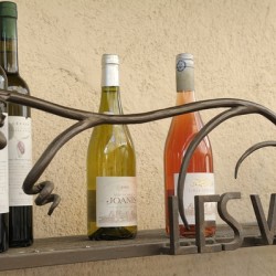 Les Vins Du Luberon store sign with bottled wine