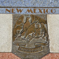 Bas relief plaque for New Mexico is inlaid into Hoover Dams plazas surface one of the seven states that fall within the Colorado Rivers basin. Hoover Dam Arizona Nevada USA