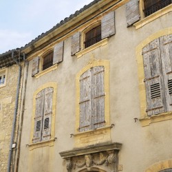Shuttered windows on an old apartment  building Lourmarin Vaucluse Provence Alpes Côte dAzur France