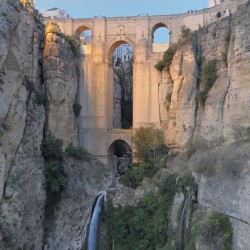 Guadalevín River and waterfall at dusk Puente Nuevo El Tajo Gorge Ronda Málaga Andalusia Spain