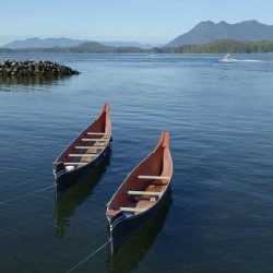 Two native canoes anchored in Tofino Harbour