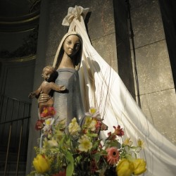 Wood carving of the virgin with bouquet of flowers Eglise Saint Pothin