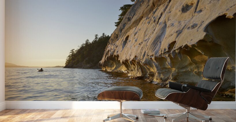 Sea kayaking under the sculpted sandstone cliffs Wall Murals