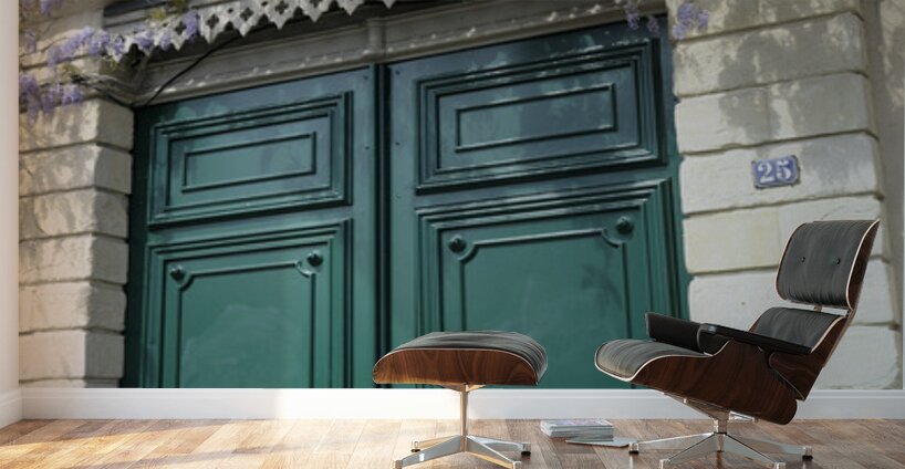 Green door with Wisteria plant in bloom. Nevers Nievre. France Wall Murals