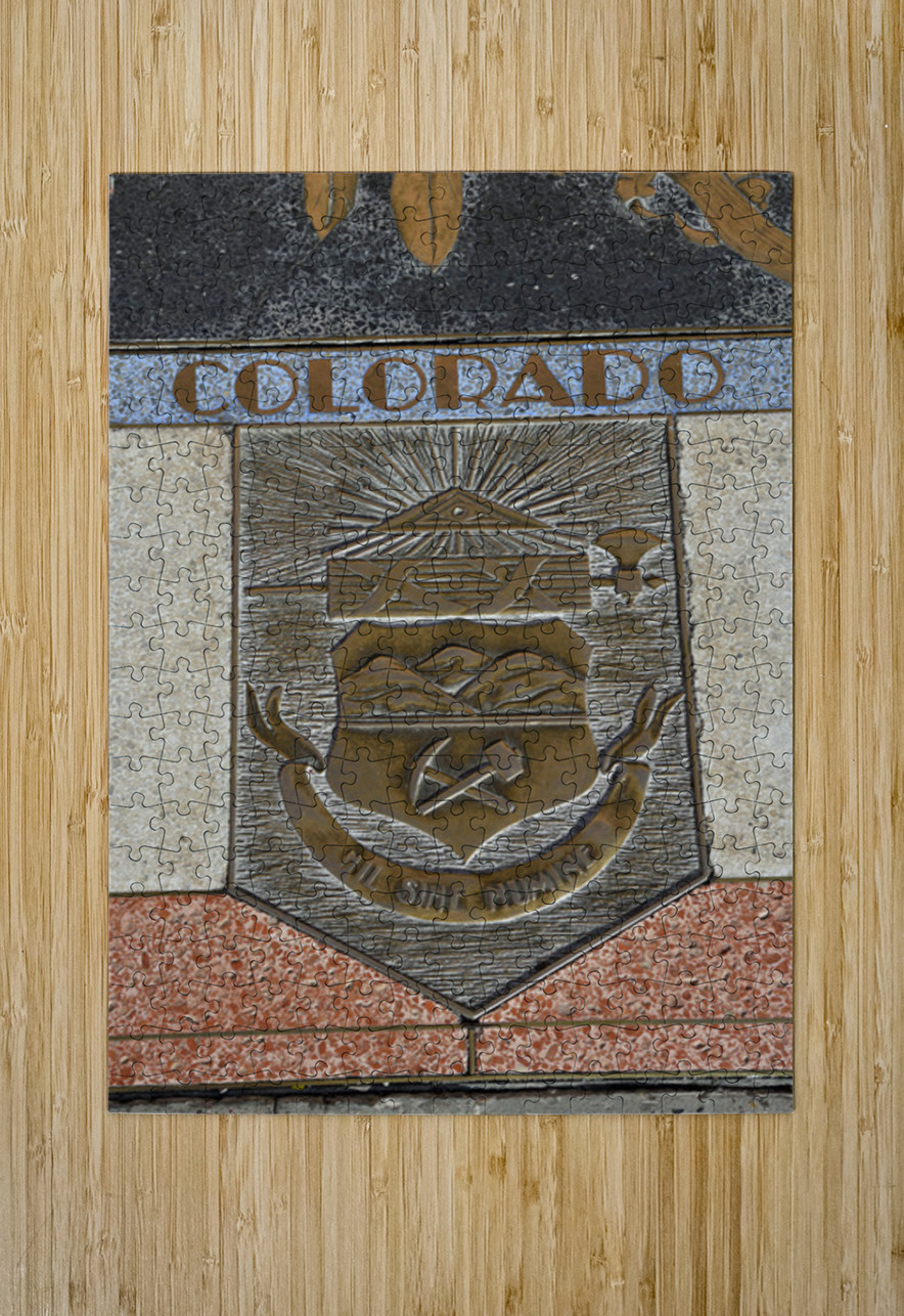 Bas relief plaque for Colorado is inlaid into Hoover Dams plazas surface one of the seven states that fall within the Colorado Rivers basin. Hoover Dam Arizona Nevada USA Kevin Oke Puzzle printing