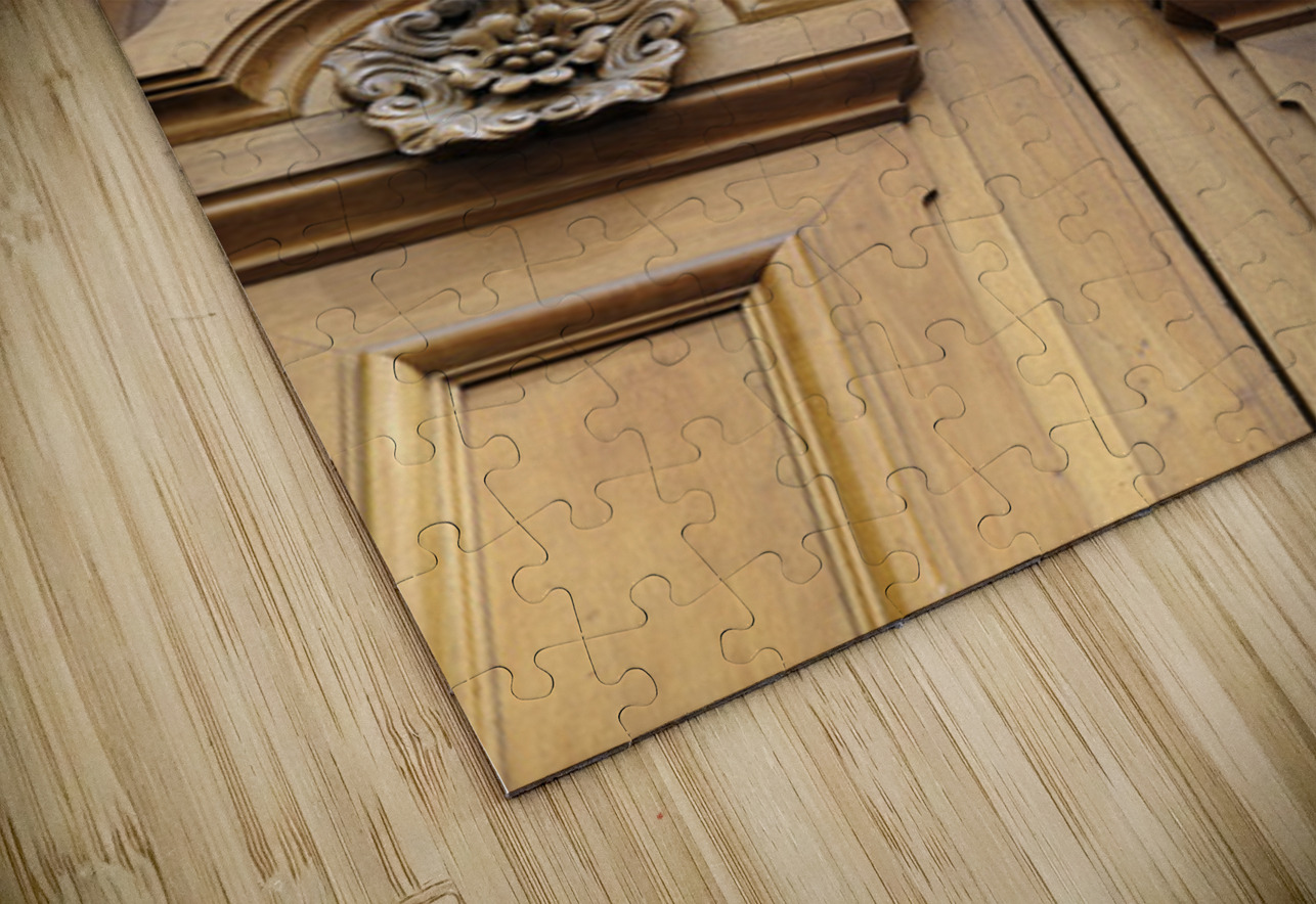 Wooden door with carved figurine in stone above it. France Kevin Oke Puzzle