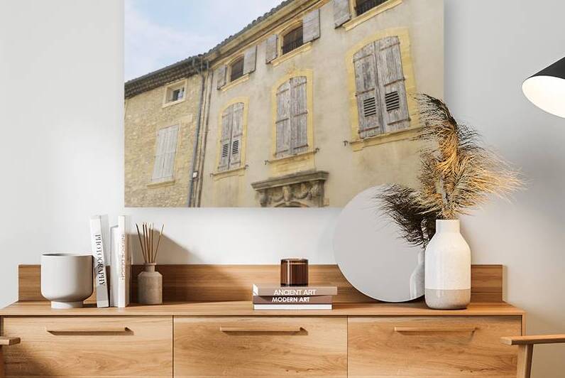 Shuttered windows on an old apartment  building in Lourmarin by Kevin Oke