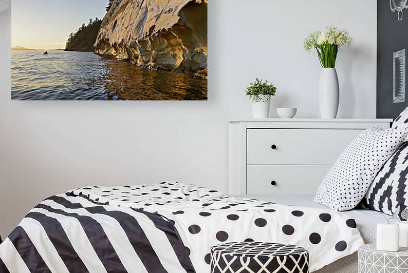 Sea kayaking under the sculpted sandstone cliffs by Kevin Oke