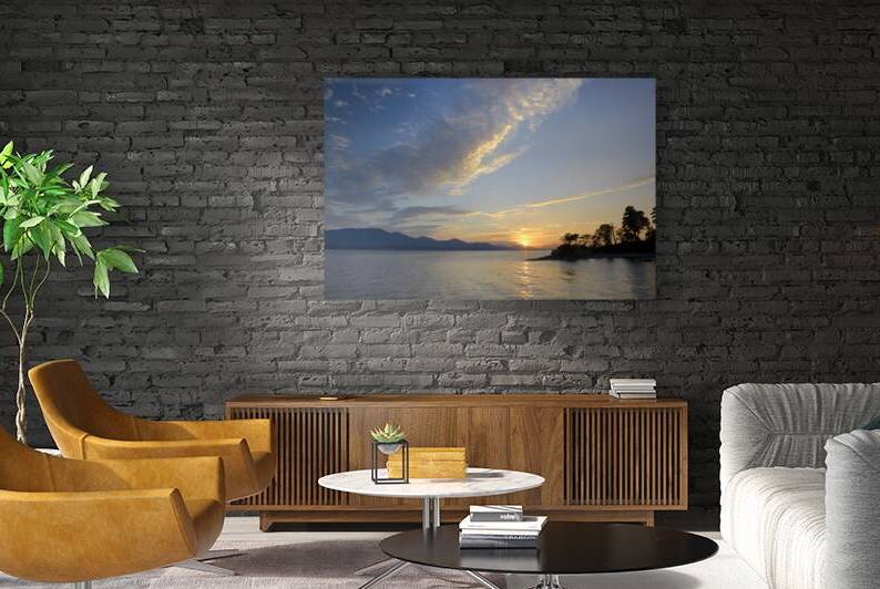 Sunset over Vancouver Island with silhouetted trees by Kevin Oke