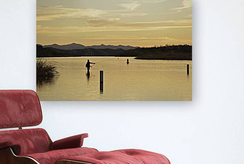 Backlit man fishing at sunset Patagonia Lake State Park Arizona USA by Kevin Oke